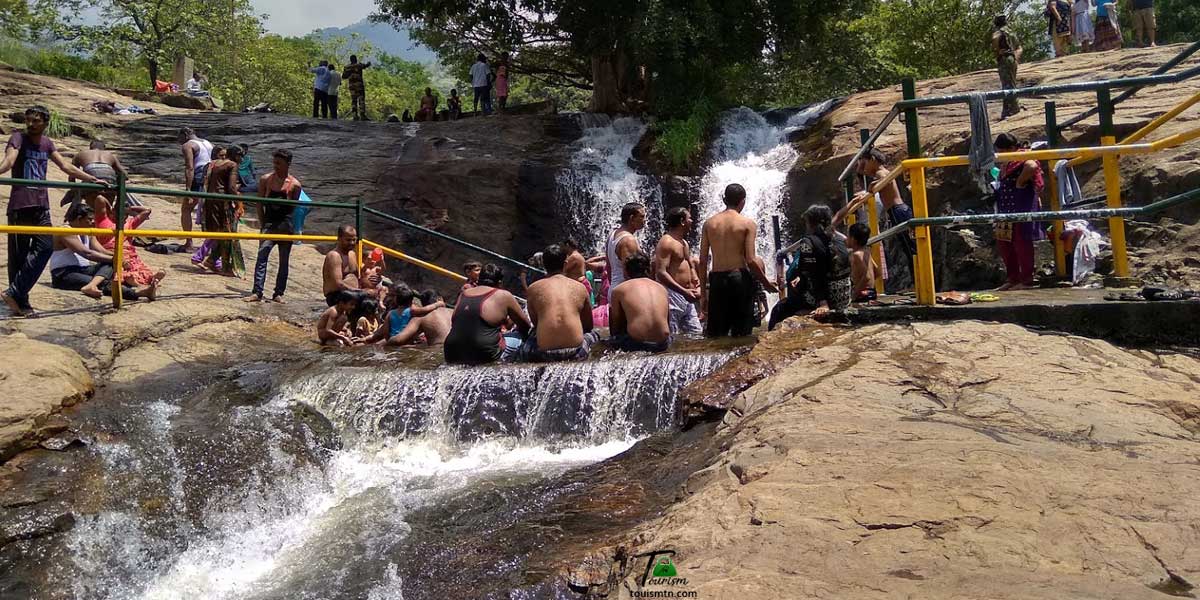 People Enjoying in Kumbakarai Waterfalls
